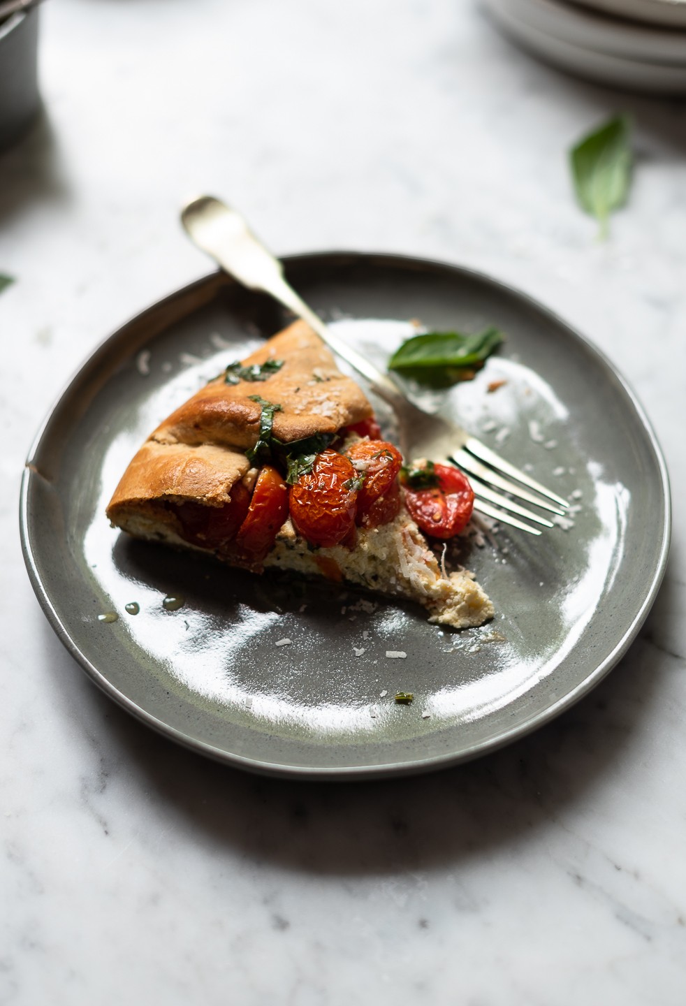 Tomato galette with ricotta and basil oil